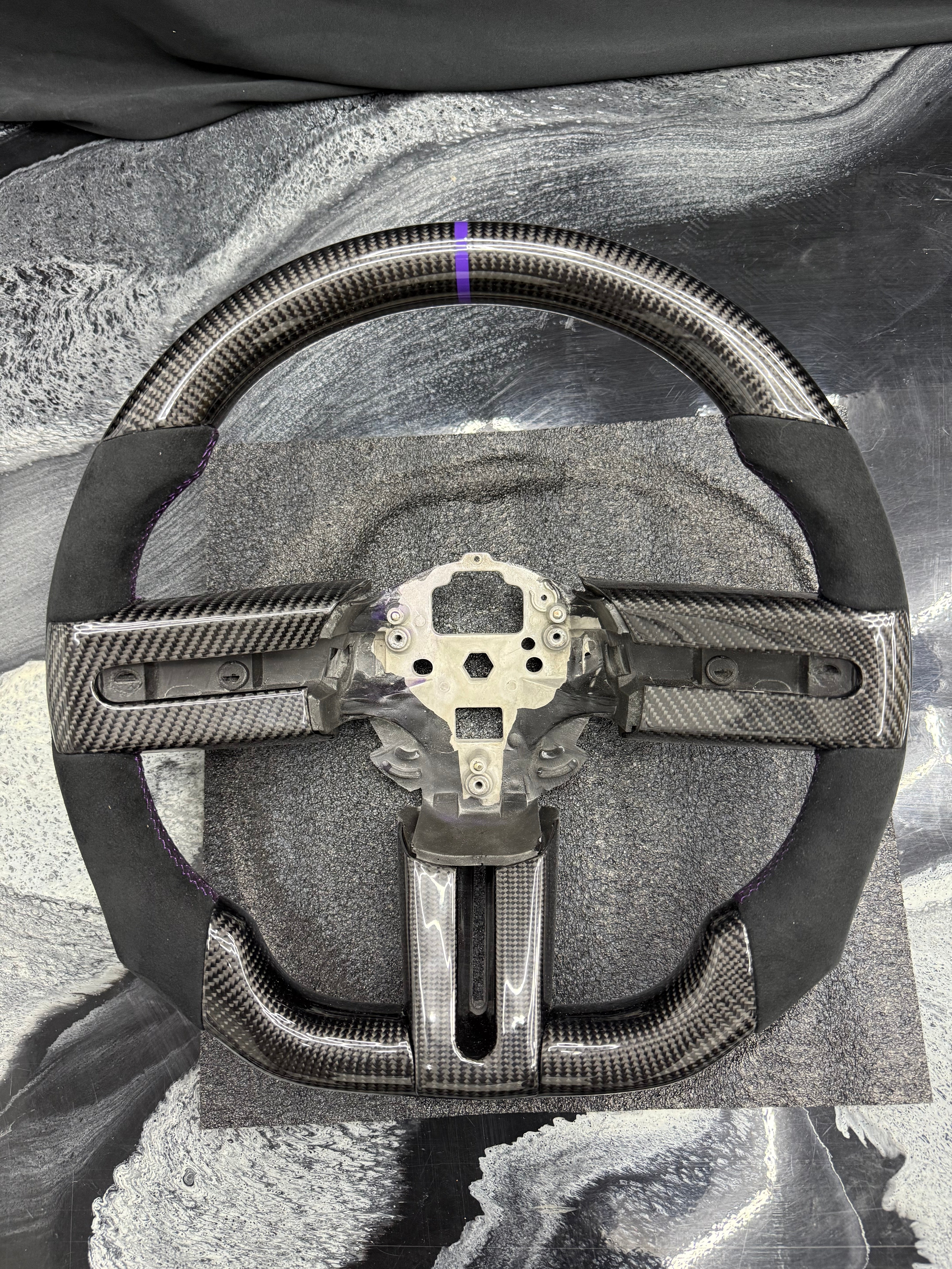 2005 - 2009 Ford Mustang S197
-Custom Carbon Fiber Steering Wheel with Alcantara Suede Hand Grips (Purple Stripe & Stitching) (IN STOCK READY TO SHIP)